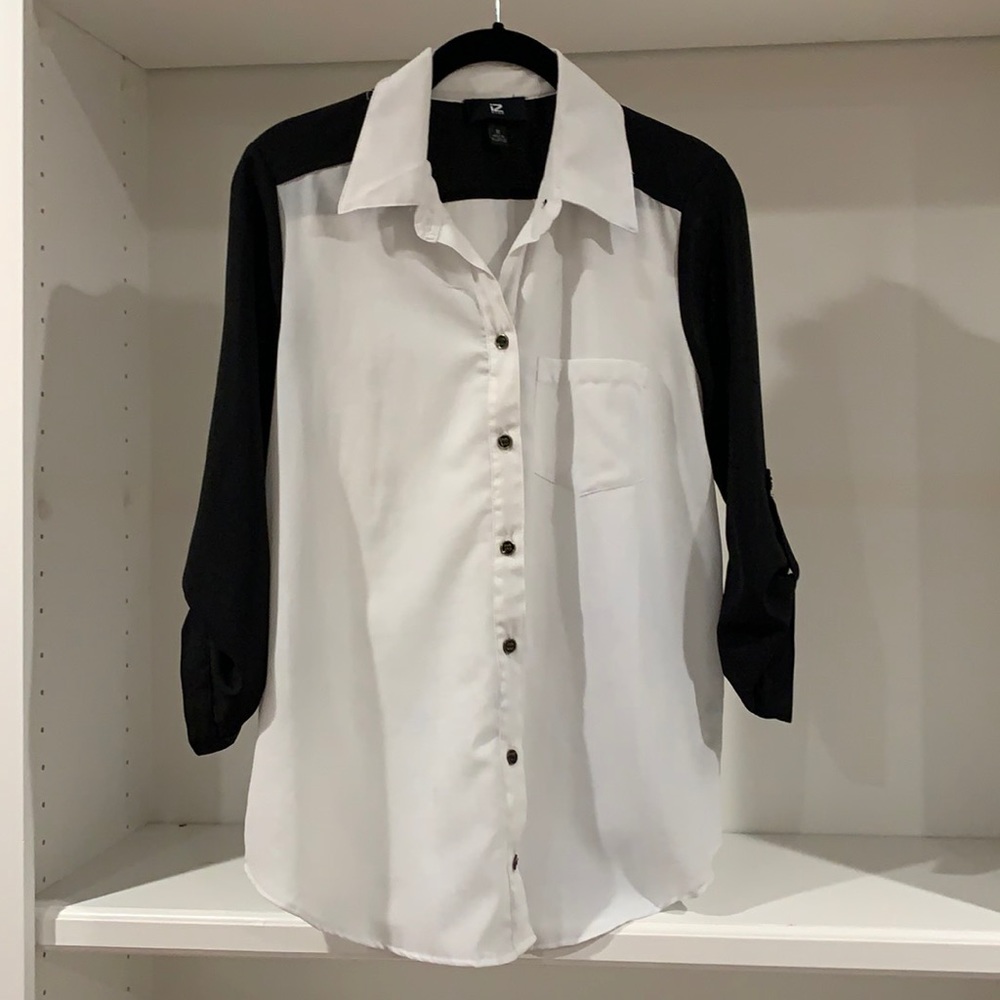 Black and white polyester top with brass buttons